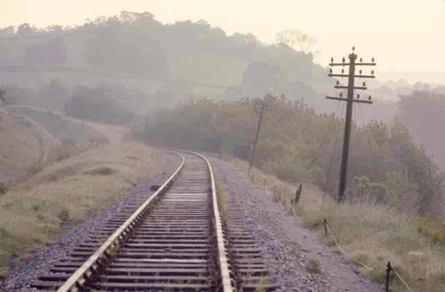 The recently abandoned S&D's sinuous curves as it exits the cutting south of Tucking Mill Viaduct